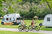 La Plage Fleurie campsite - Couple on electric bikes 