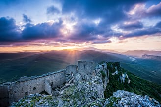 Le Brasilia campsite, Château de Peyrepertuse castle at sunrise Languedoc France © Shutterstock